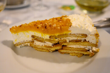 Traditional Portuguese cake with cream, fruits and cookies