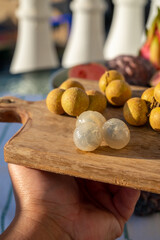 Tasty tropical exotic fruits, ripe fresh peeled lychee fruits