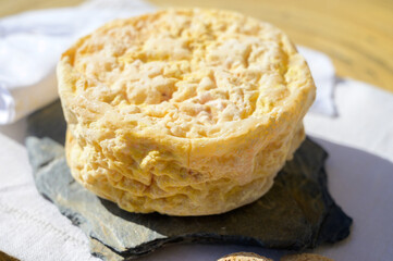 Tasting of local portuguese matured cheese queijo serpa,  Setubal area, Portugal