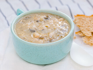 White bean soup in blue bowl