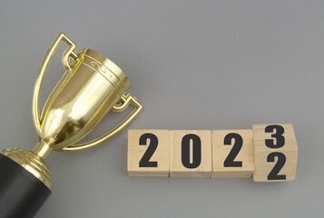 Gold trophy champion cup and flipping numbers 2022 and 2023. Sport competitions in season...