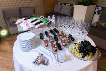  catering sweets at the event. eclairs in chocolate 