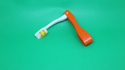 Foldable toothbrush that is easy to carry anywhere isolated white green  