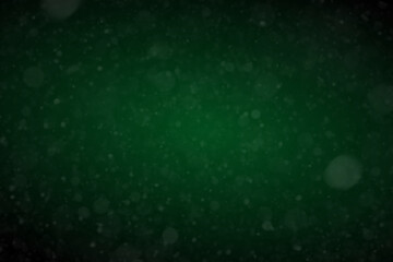 Green christmas atmosphere background. Abstract Christmas background with snowflakes. Beautiful glowing snow Christmas background with snow flakes