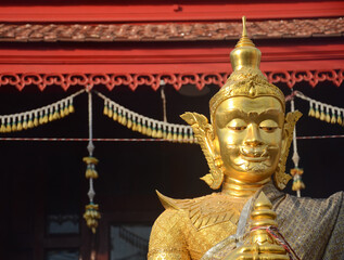 Front view of Thao Werasuwan gold color at Chulamani Temple, Samut Songkhram Province. Thailand