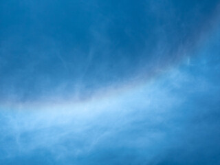 Solar Halo with Rainbow Colors in a Blue Sky