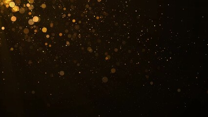 Golden glitter floating in the air. Concept of Merry Christmas and Happy New Year.