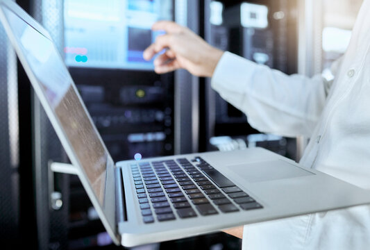 Server room, network and laptop with businessman in data center for engineering, technology and cloud computing. Cybersecurity, internet and mining with hands of employee for hardware maintenance
