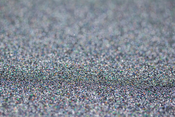 Macro image of a sparkling silver color glitter texture background