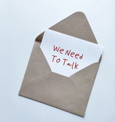 Craft envelope with card written - We Need to Talk - concept of having difficult conversations to...