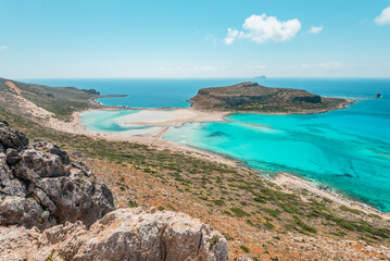 Balos lagoon, crete island, greece: view to tagani island with white sandy beach and turquoise blue water at the main tourist destination near chania