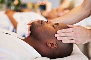Massage, sleeping and face of a black man at a spa for peace, relax and luxury service with the...