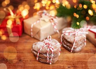 christmas cookies on wooden table close-up on bokeh background