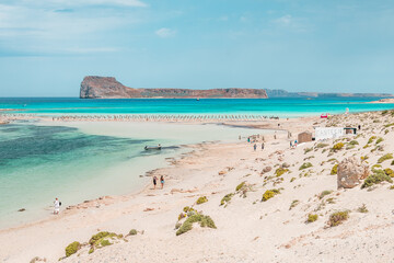 Balos lagoon, crete island, greece: view to gramvoussa island with white sandy beach and turquoise blue water at the main tourist destination near chania