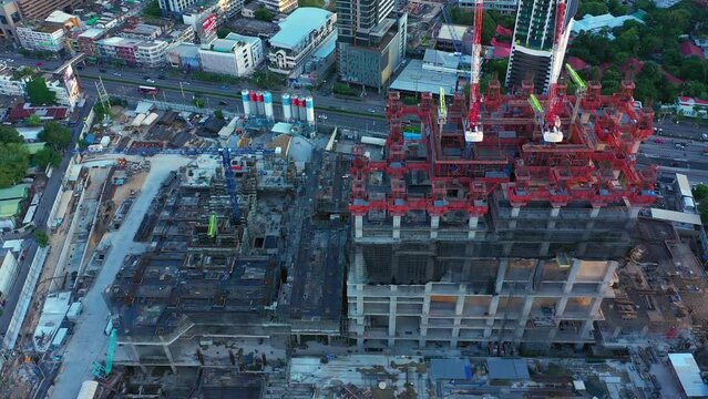 Aerial view of construction site with tower crane urban construction Rush hour of concrete pouring
