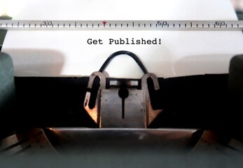 A vintage typewriter with paper feeding and text typed GET PUBLISHED, concept of book writer author must get their manuscript to be read by editors and published by publisher or self-publishing