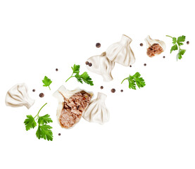 Khinkali with allspice and parsley in the air closeup isolated on a white background
