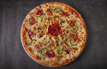 Tasty peroni pizza on rustic background. Top view of hot pepperoni pizza.