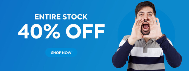 Coming Soon. Shouting coming soon. Young happy Indian Pakistani man announcing coming soon with his hands to his mouth isolated on blue background banner and with copy space. 