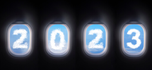cloud 2023 outside the plane window for new year celebrate , four airplane windows open white...