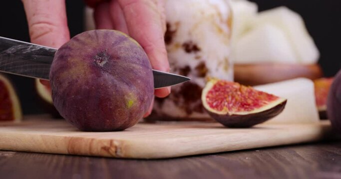Sliced ripe purple figs with red pulp, delicious and fresh figs cut into slices