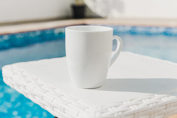cup of coffee on the table for a mockup, add your own logo or text 