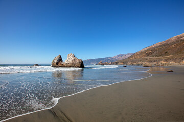 Rising tide at Pacific Valley beach on the Big Sur central California coastline United States