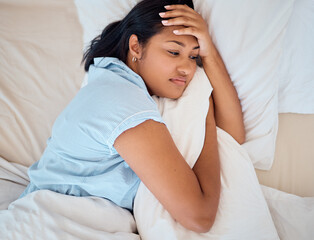 Depression, sleeping and woman in bed with mental health problem, burnout and tired student thinking of life challenge and wellness. Sad, depressed or fatigue girl with pillow in her bedroom above