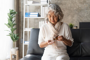 Mature woman taking out pills from bottle, supplements or antibiotic, older female preparing to take emergency medicine, chronic disease, healthcare and treatment concept - obrazy, fototapety, plakaty