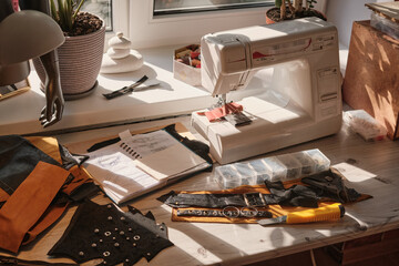 Workspace of Stylist. Workplace of a designer of fashionable belts and bags. Hobby concept. Making accessories by handmade.