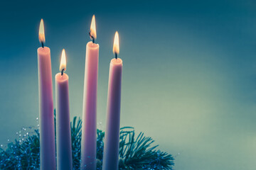 advent wreath with 4 pink advent candles burning