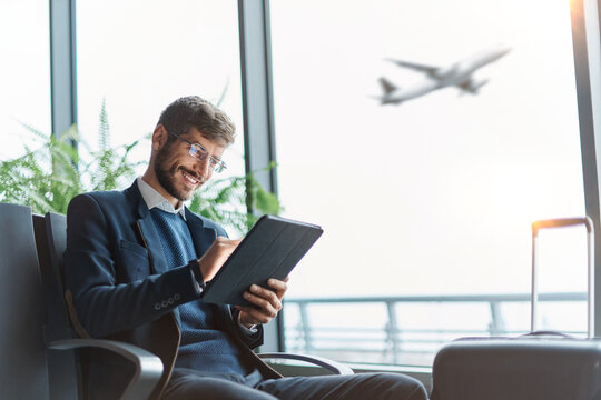 business man using a digital tablet during a business trip.