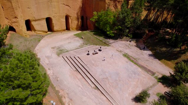 establishing shot showing a DJ setting up outside Bruoux Mines