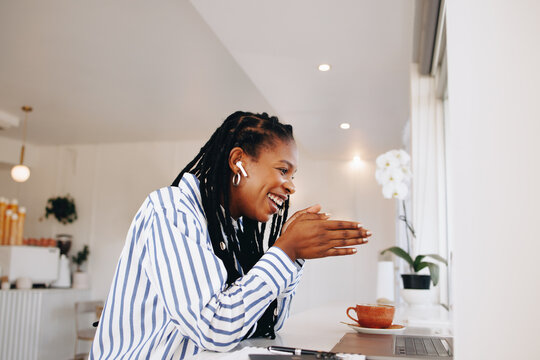 Smiling Black Businesswoman Having A Virtual Meeting With A Client In A Cafe