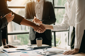 business people shaking hands during a meeting - obrazy, fototapety, plakaty