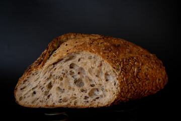 Ukrainian multigrain bread on a black background.