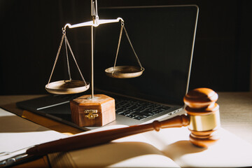 Business and lawyers discussing contract papers with brass scale on desk in office. Law, legal...