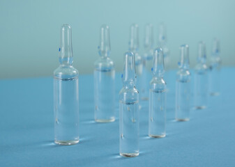 medical drug. ampoules with medicine on a blue background. cosmetology and medicine.