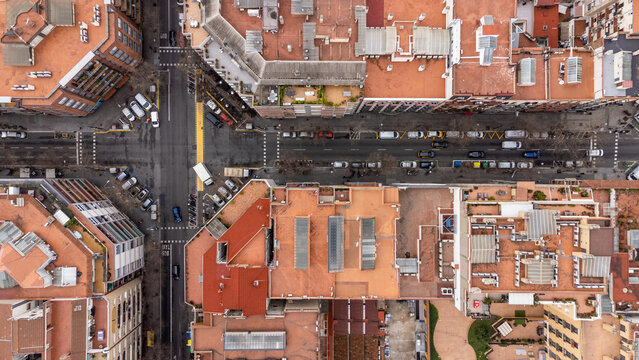 perpendicular view of the rooftops and street of the eixample district in barcelona