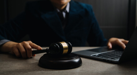 Business and lawyers discussing contract papers with brass scale on desk in office. Law, legal services, advice, justice and law concept picture with film grain effect