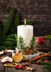 Christmas white candle decorated with thuja leaves, jute wool, bark star. Handmade home decoration....