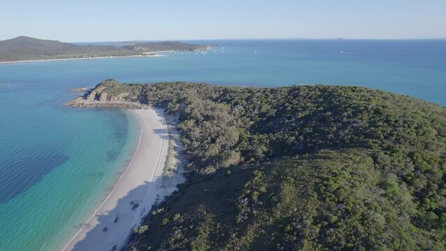Lush Forest And Sandy Beach At Great Keppel Island On The Southern Barrier Reef, Capricorn Coast, QLD Australia. Aerial Pullback