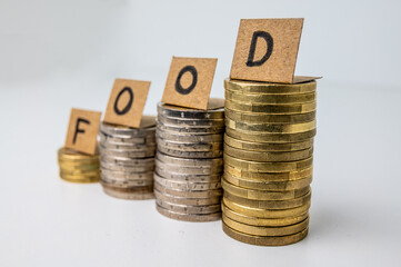 Stacks of coins, and above tickets that spell the word 