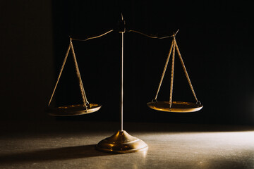 Business and lawyers discussing contract papers with brass scale on desk in office. Law, legal...