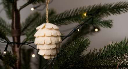 Zero waste christmas concept. Christmas tree decorated with pine cone ornaments made of natural...