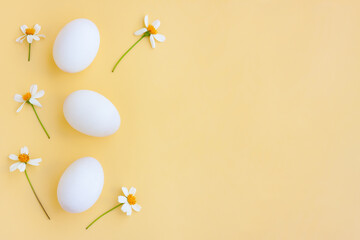 White eggs with White flowers blooming on yellow background, Duck eggs.