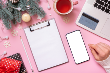 Blank paper on tablet and phone mock up, credit card with Cristmas New Year work table decoration top view, flat lay on pink background