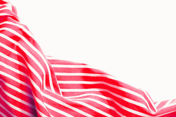 Beautiful red fabric with white stripes background. Draped background of fabric, texture