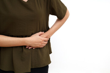 Close up photo of woman hand holding her left stomach. Gastrointestinal tract diseases. Isolated on...