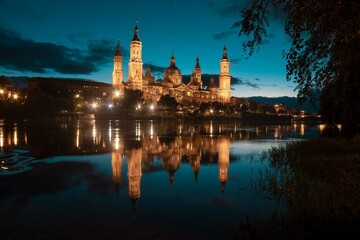 Autumn photography at sunset from the Basilica of Our Lady of the Pilar in Zaragoza, next to the Ebro river and the Stone Bridge, Aragon, Spain.
